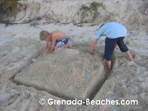 grand anse beach kids building sand castle grenada beaches